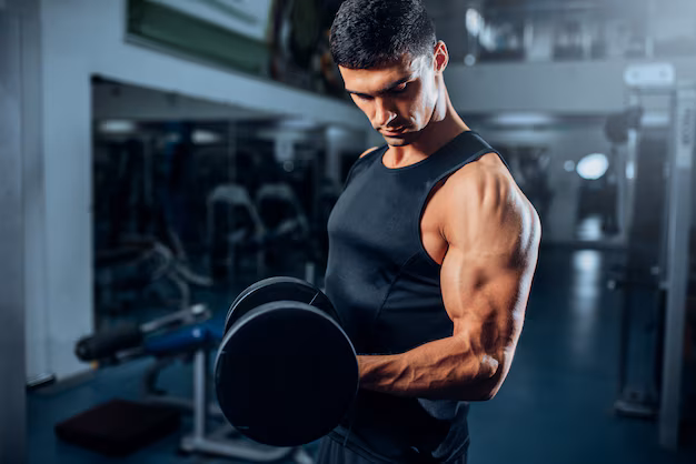 tanned muscular athlete workout with dumbbell gym 266732 275 (1)